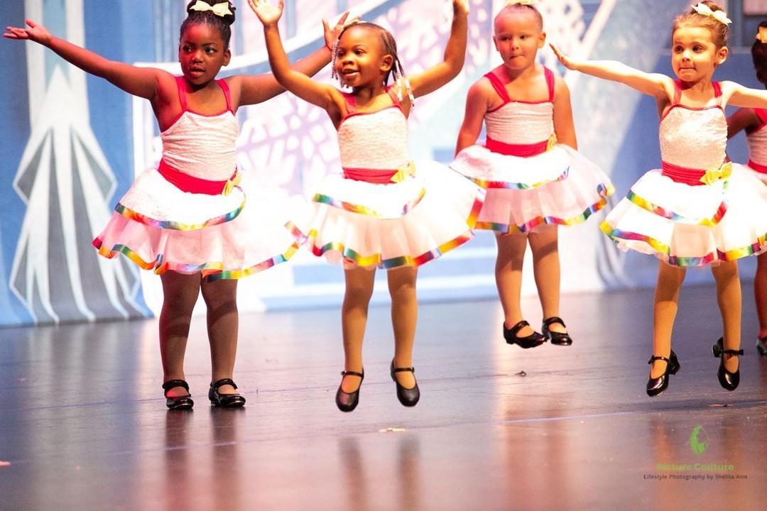 young dancers jumping on stage